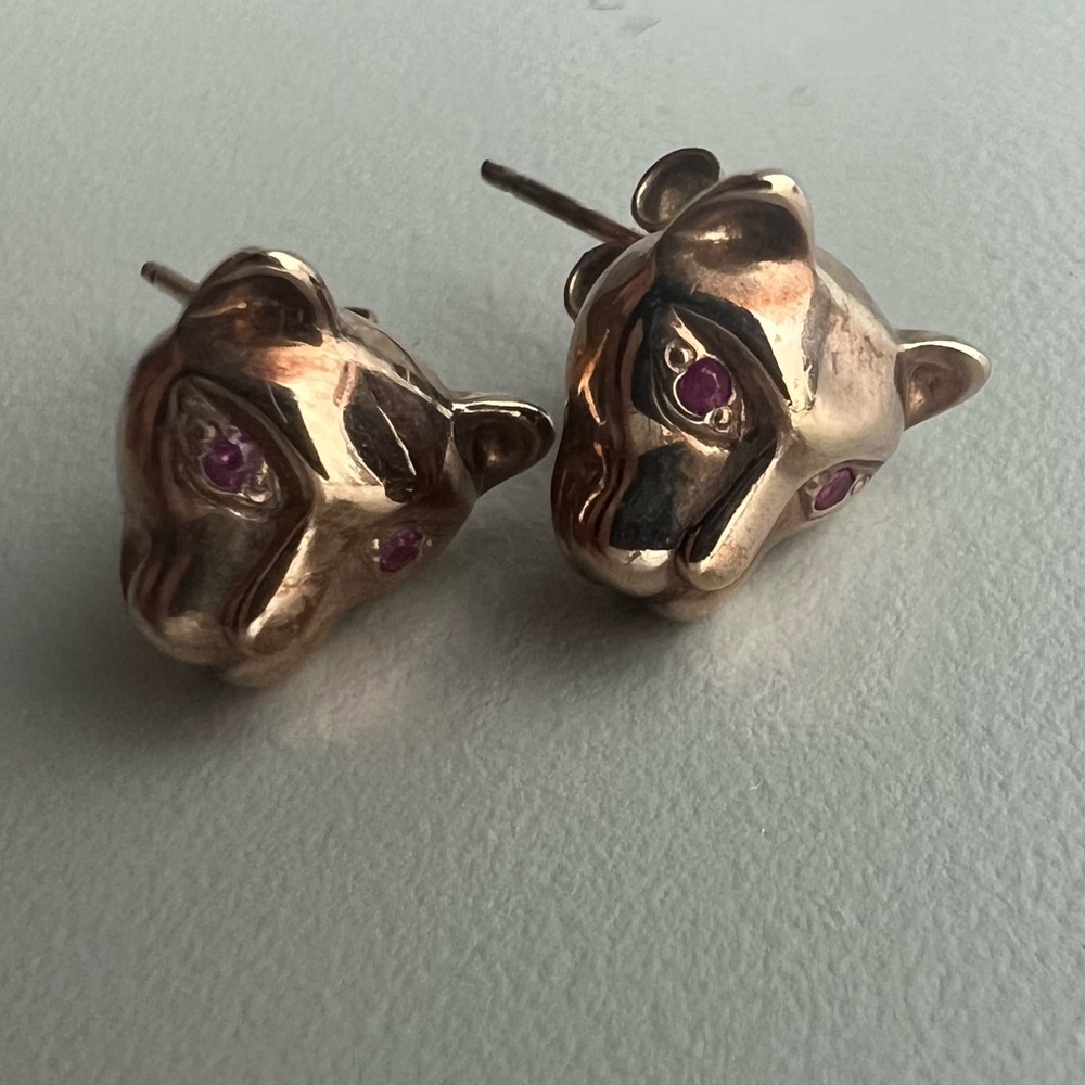 Rose gold earrings, panthers with ruby eyes.